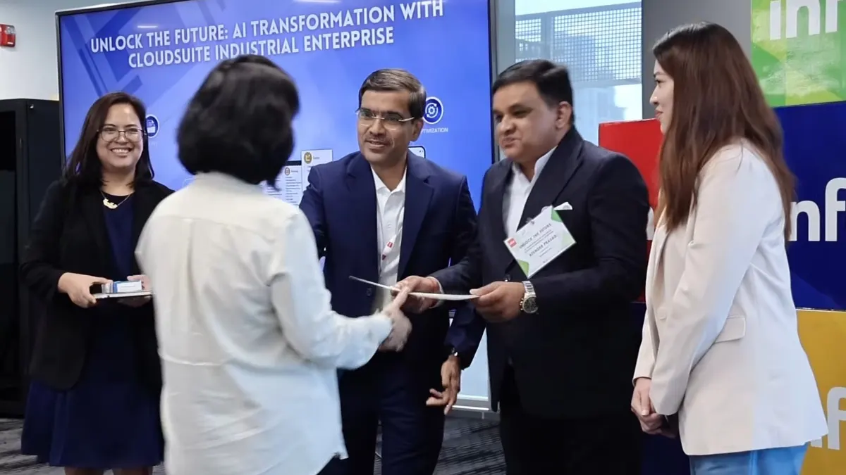 Executives handing a certificate to a guest at a company conference